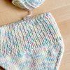 Detail pleteného nákrčníku z vlny The Petite Wool